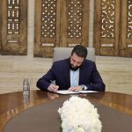 Ahmad Al-Sharaa signs document