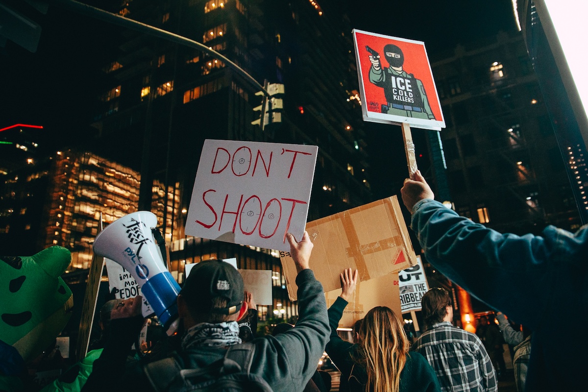 Anti-ICE signs during protest in San Diego