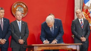 José Antonio Kast signs document
