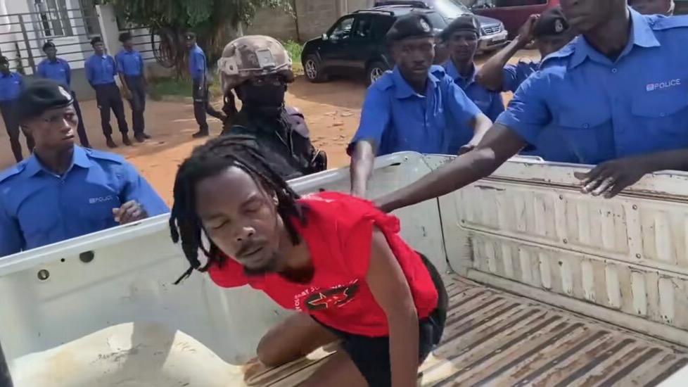 activist Alieu Bah thrown in white truck by Gambian police