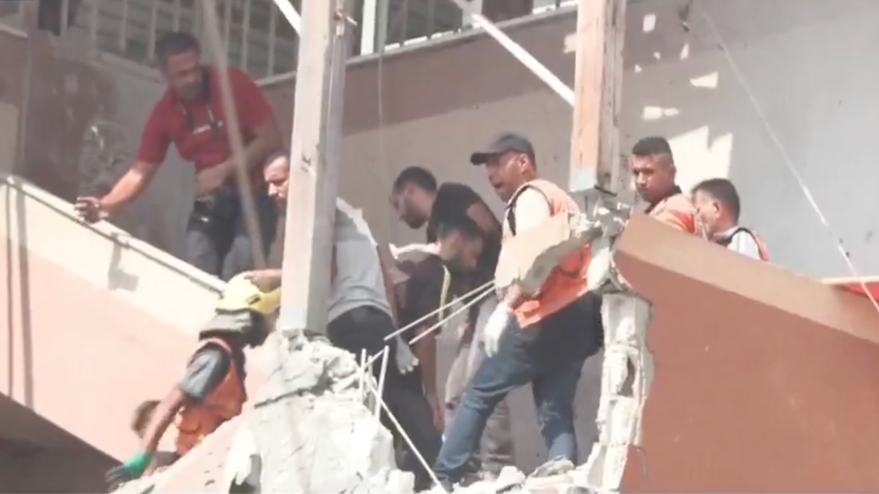 Journalists and medical crews at the scene of Israeli hospital attack