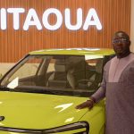 Man poses with 100% electric car made in Burkina Faso