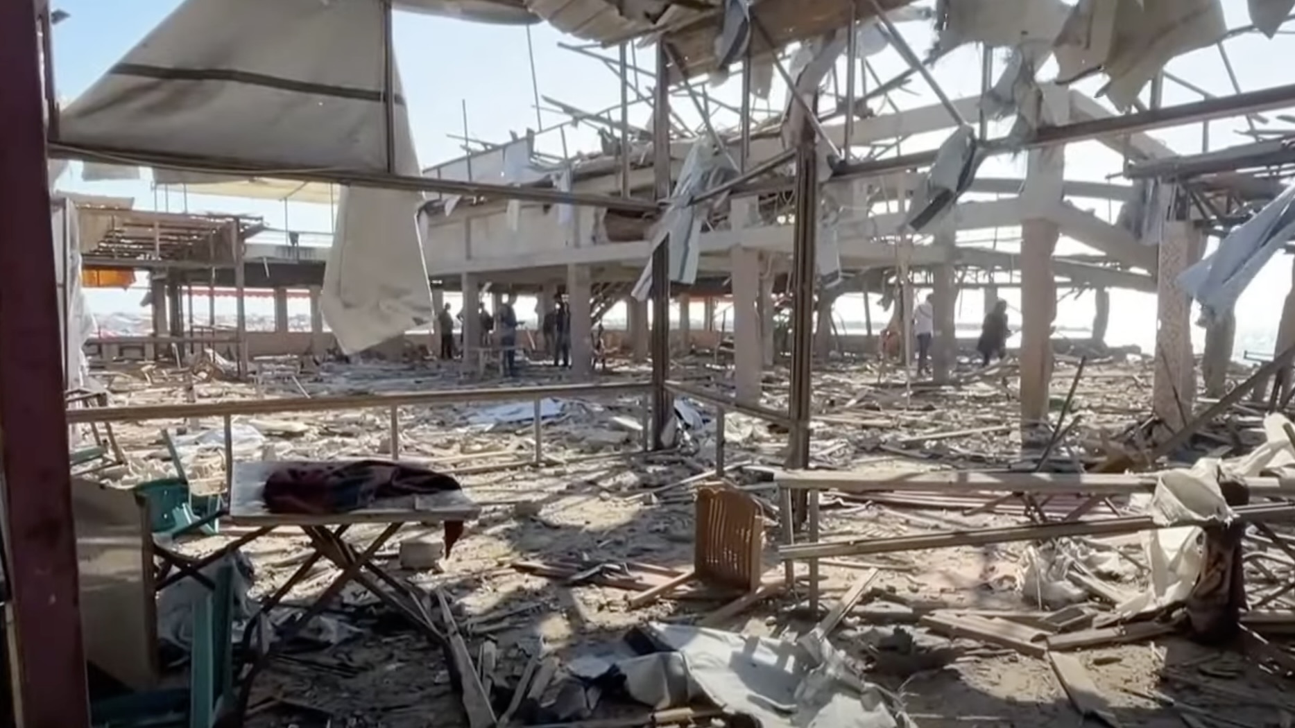 Israeli airstrikes on Gaza beach kill dozens, including a journalist