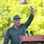 Miguel Diaz-Canel waves Cuban flag