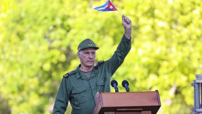 Miguel Diaz-Canel waves Cuban flag