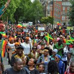 People of the African diaspora in London wave flags of their countries and march for reparations